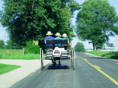 Amish Pole Barn Construction in Penns Grove, NJ - Rossbrook Construction Family riding along rode in carriage.