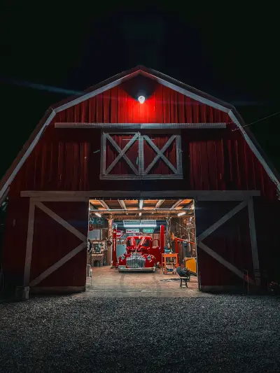 Amish Pole Barn Construction in Pilesgrove, NJ - Rossbrook Construction Red pole barn at night